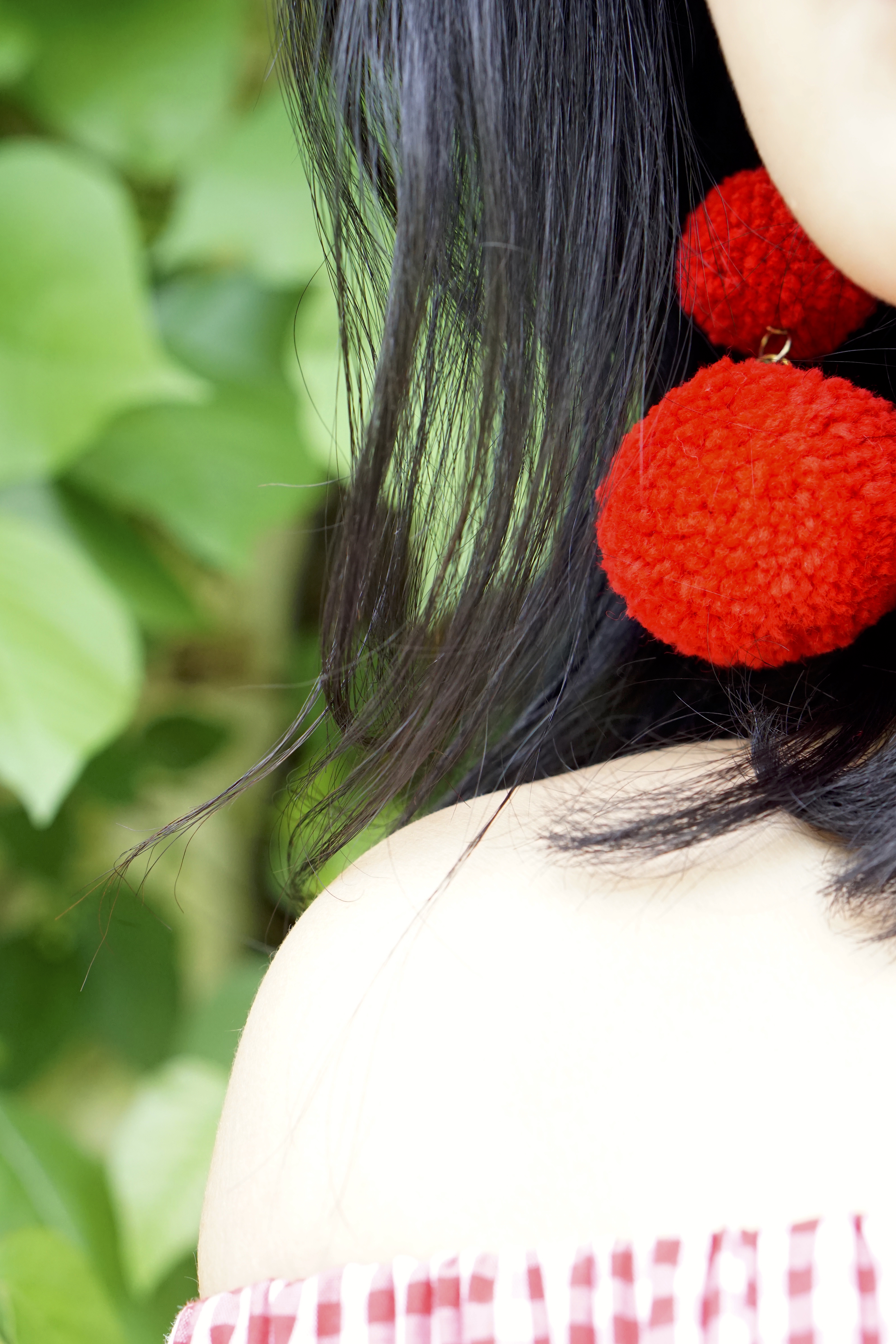 red pompom earrings